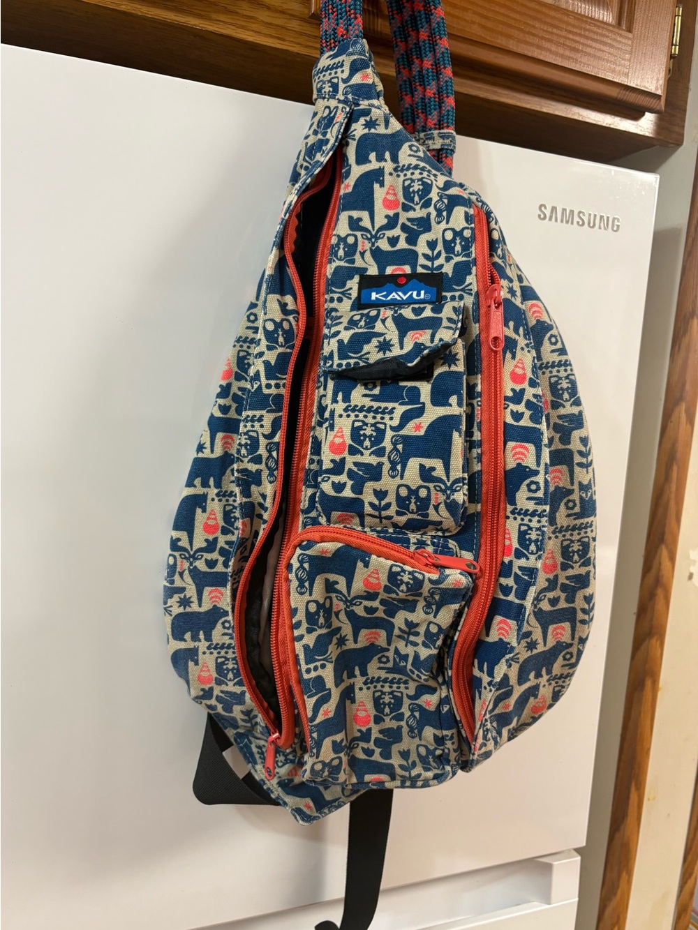 Kavu Men’s Blue and Cream Patterned Rope Sling Bag with Coral Zippers